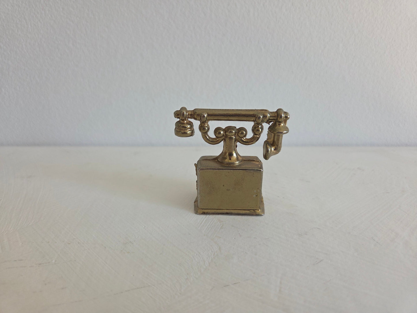 telefoon miniatuur messing gebruikssporen