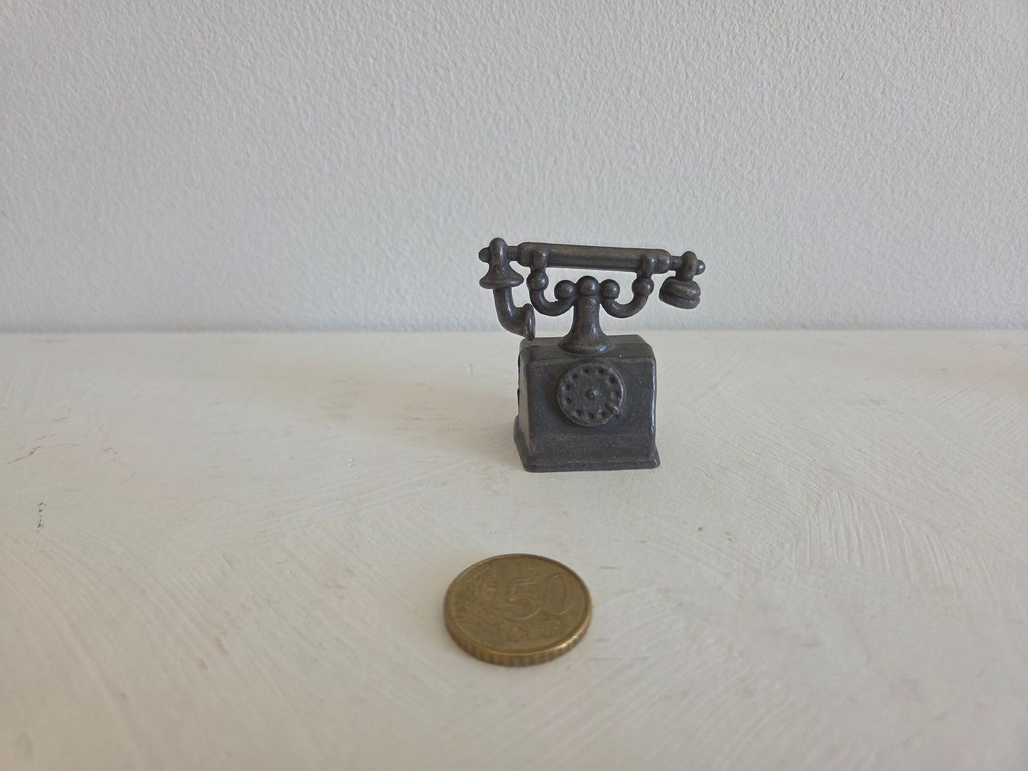 miniatuur telefoon met drie stempels