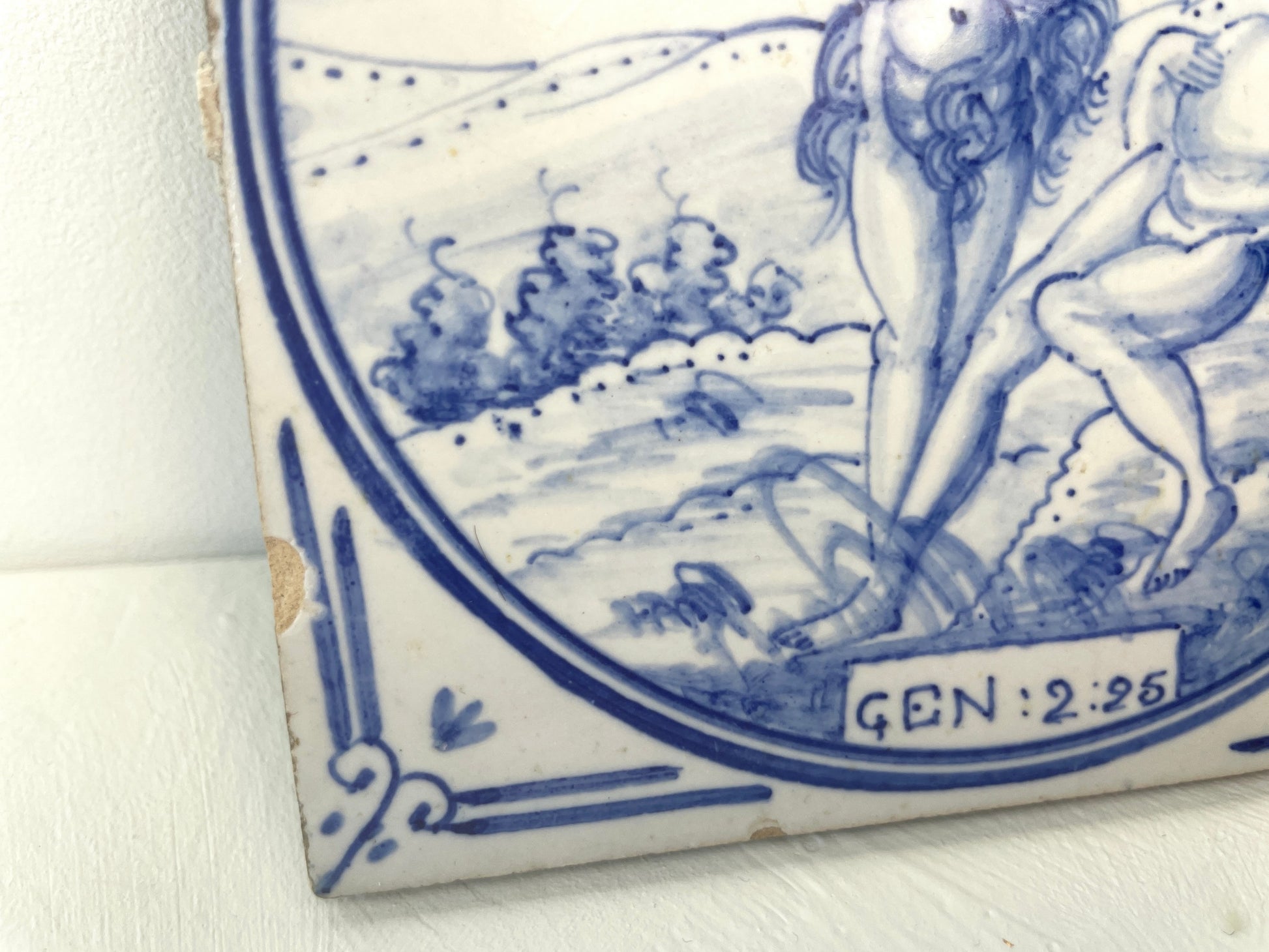 Keramieken tegel begin 20e eeuw met Adam en Eva