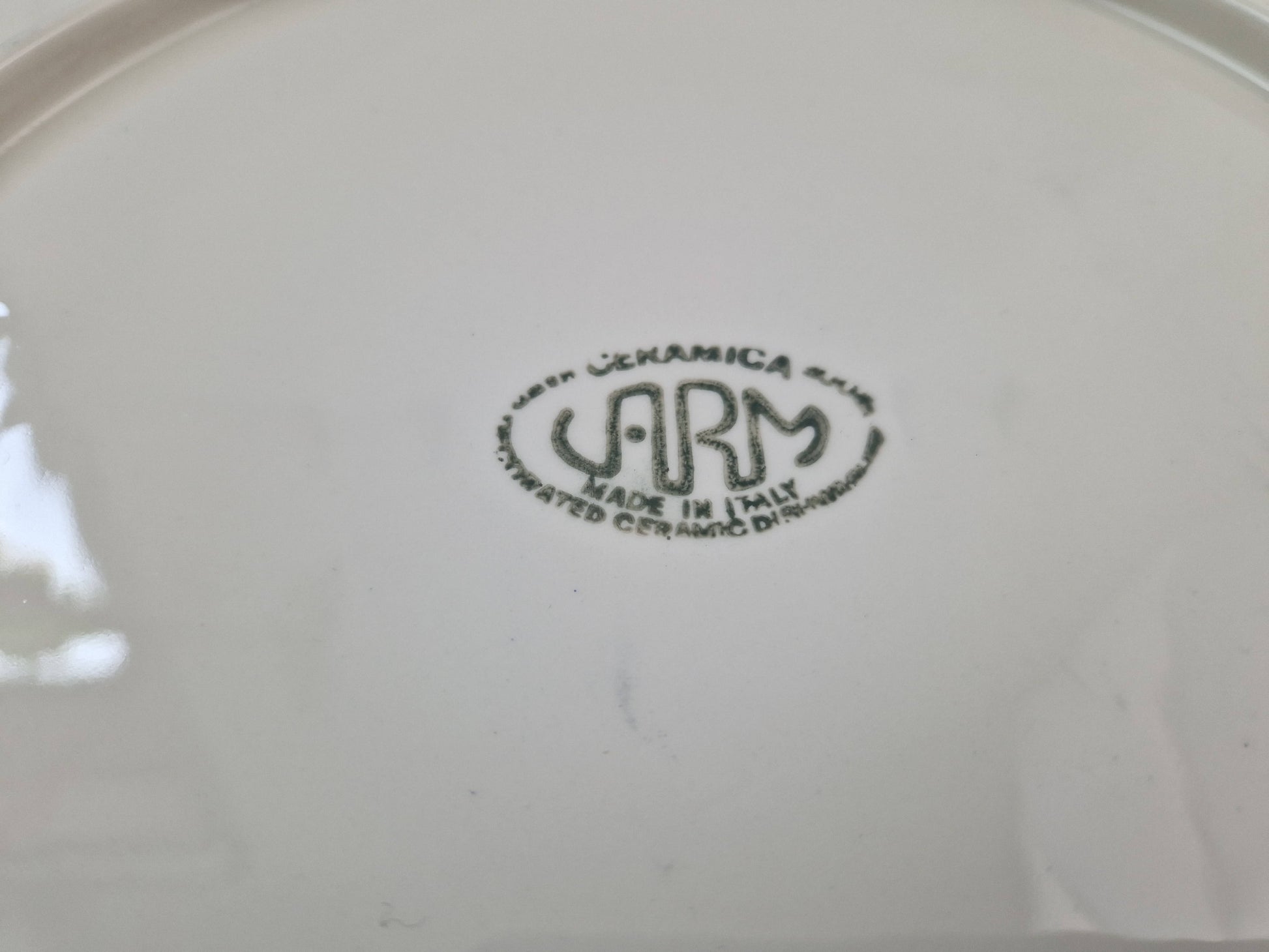 Italiaans bord met vogelillustratie