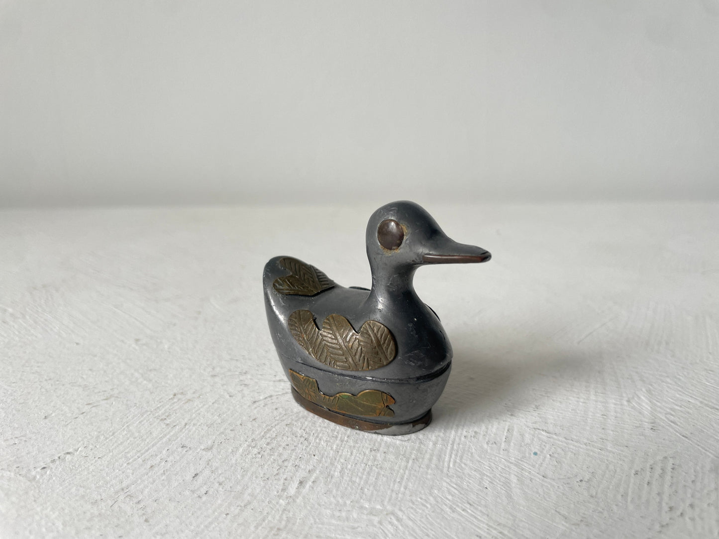 kleine eend goudkleurige details