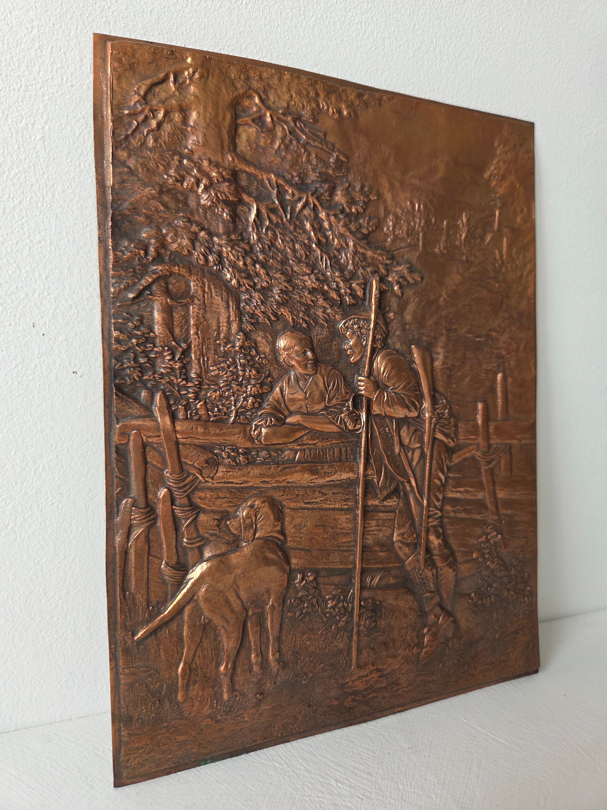 koperen reliëfplaat met jager en hond