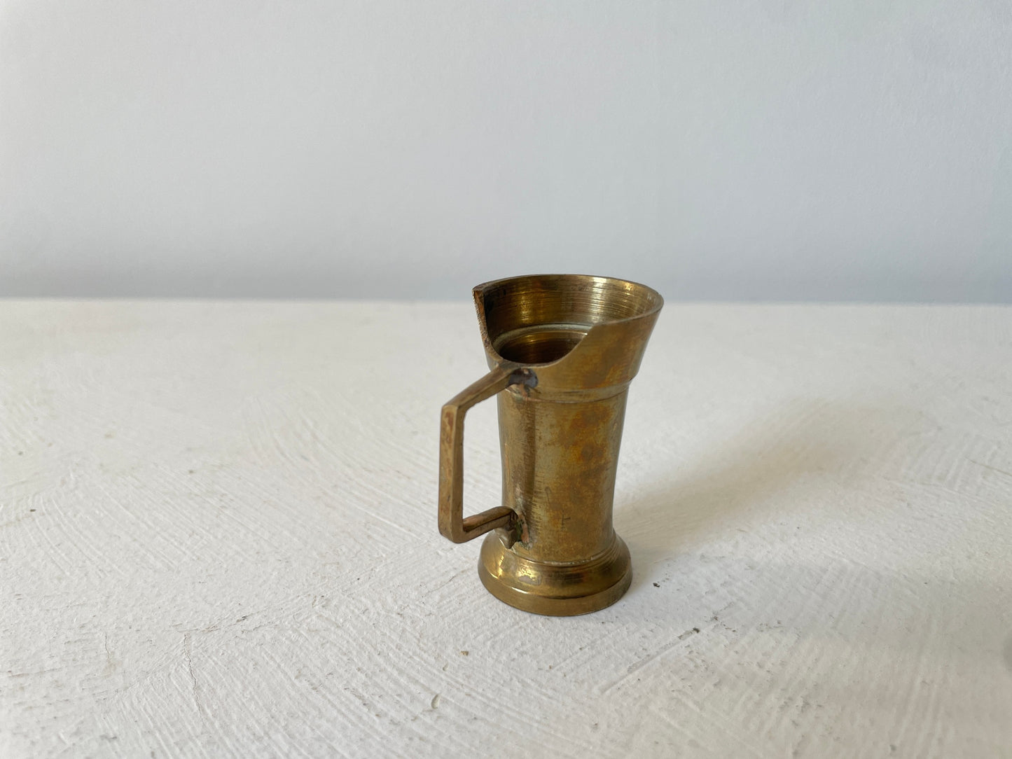 kleine messing maatbeker