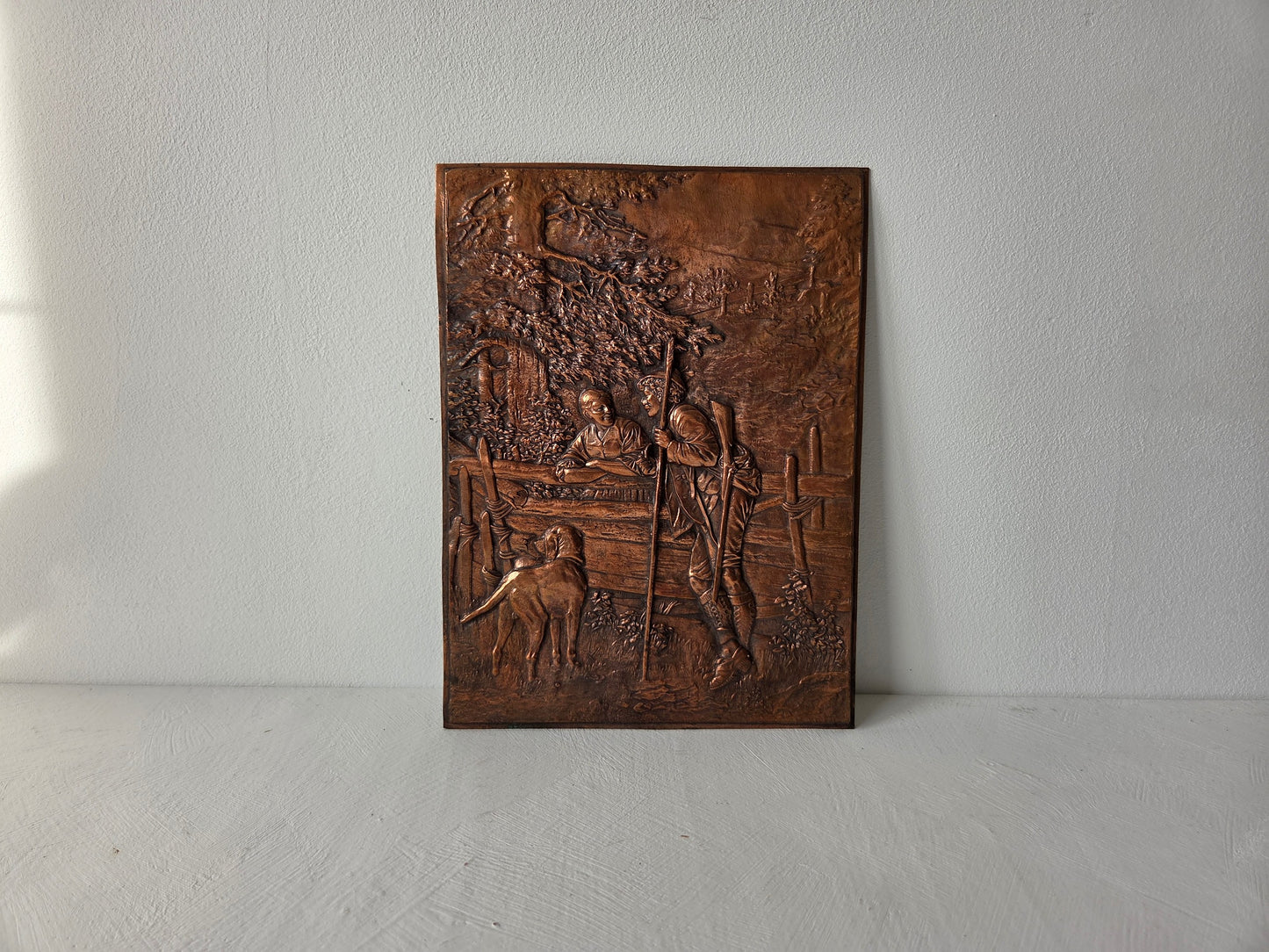 kleine rechthoekige koperplaat met reliëf