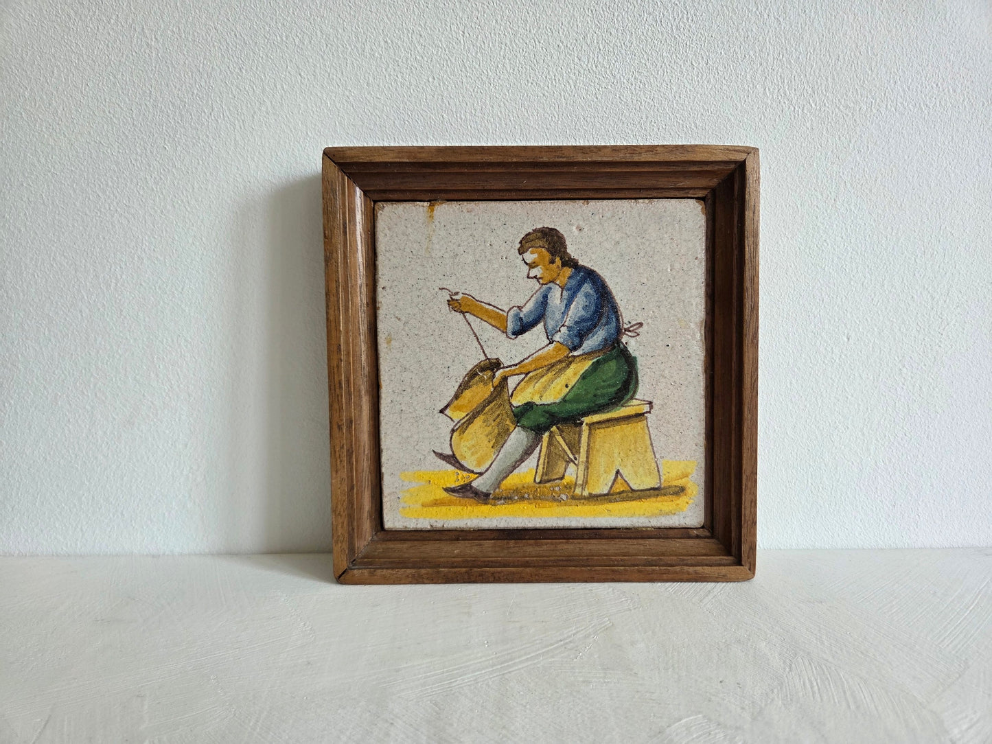 faience tegel Petits Métiers ambachtsman blauw jasje geel